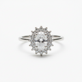 Diamond ring with a star-shaped halo on a white background