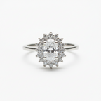 Diamond ring with a star-shaped halo on a white background