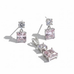 Pair of pink gemstone earrings on a white background