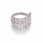 Silver ring with diamond accents on a white background