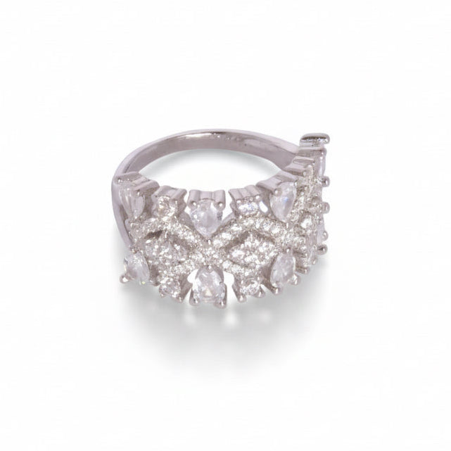 Silver ring with diamond accents on a white background