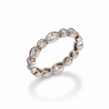 Silver ring with embedded stones on a white background