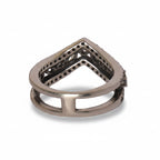 Silver ring with geometric design on a gray background