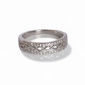 Silver ring with diamond-like stones on a light gray background