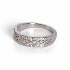 Silver ring with diamond accents on a white background