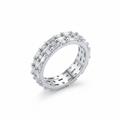 Silver ring with diamond accents on a white background