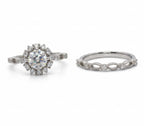 Two silver rings with gemstones on a light gray background