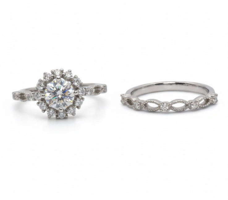 Two silver rings with gemstones on a light gray background