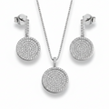 Silver jewelry set with necklace and earrings on a light gray background