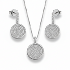 Silver jewelry set with necklace and earrings on a light gray background