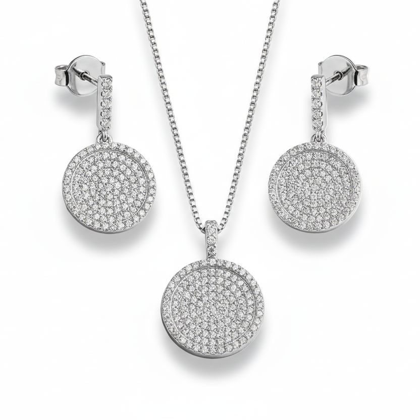 Silver jewelry set with necklace and earrings on a light gray background