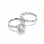Two silver rings with gemstones on a light gray background