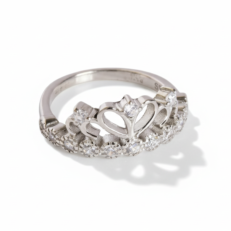 Silver ring with diamond accents on a white background