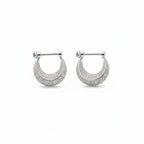 Silver earring with a blue gemstone on a white background