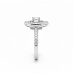 Silver ring with a central diamond and smaller diamonds around on a white background