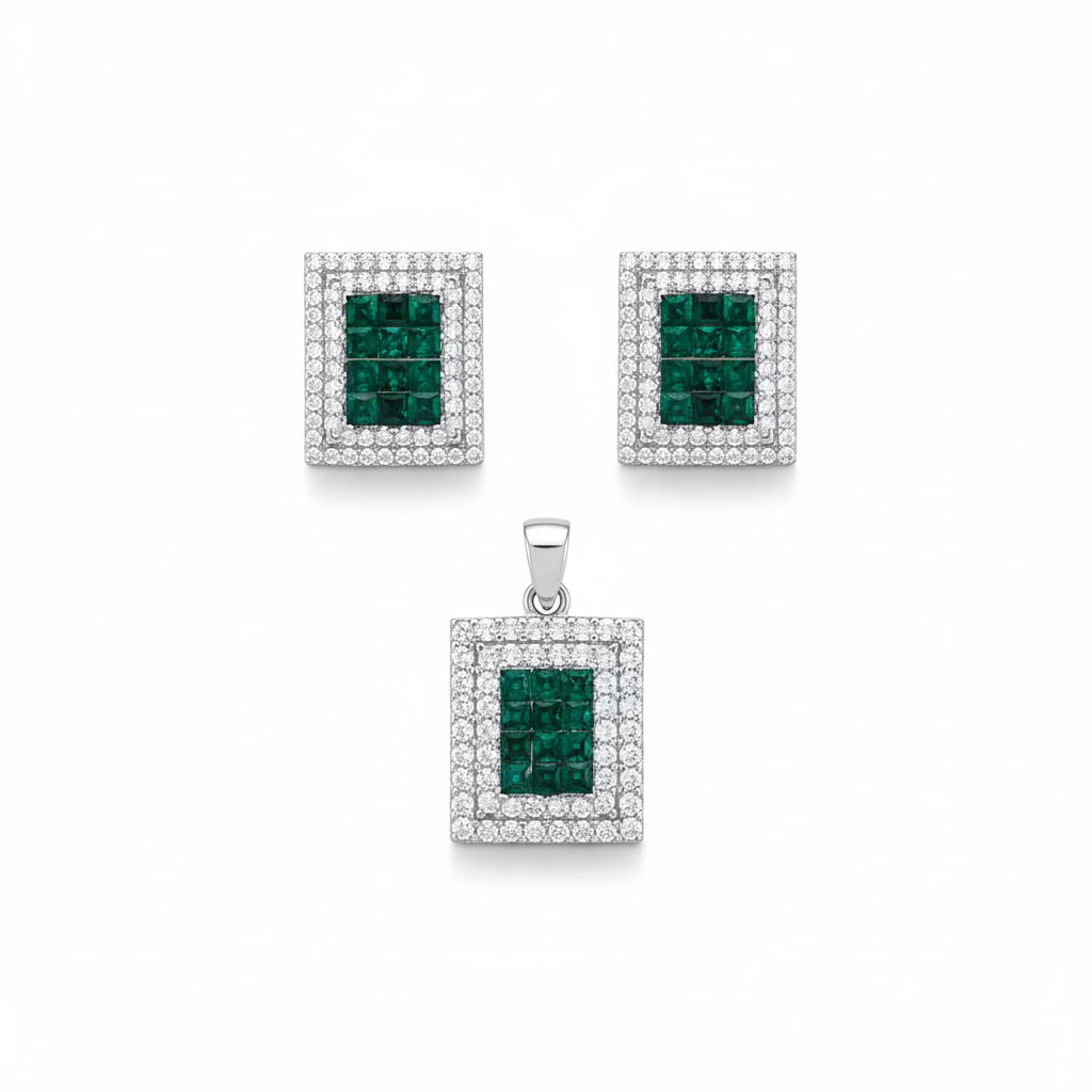 Jewelry set with square pendant and earrings featuring emeralds and diamonds on a white background