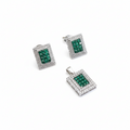 Set of silver jewelry with green gemstones on a white background