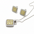 Jewelry set with yellow gemstones and silver accents on a white background