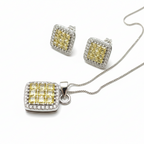 Jewelry set with yellow gemstones and silver accents on a white background