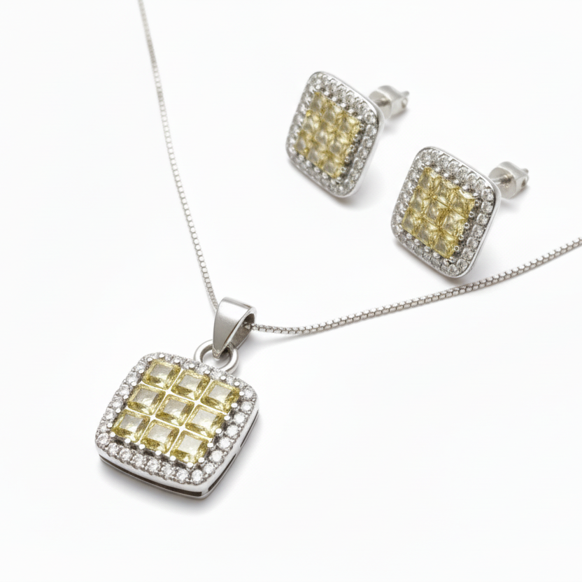 Jewelry set with square pendant and matching earrings on a white background