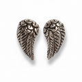 Pair of silver angel wing earrings on a white background