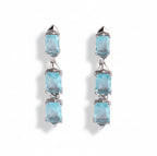 Pair of earrings with blue gemstones on a white background