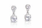 Pair of silver earrings with clear gemstones on a light gray background