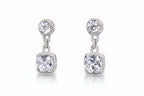 Pair of silver earrings with clear gemstones on a light gray background