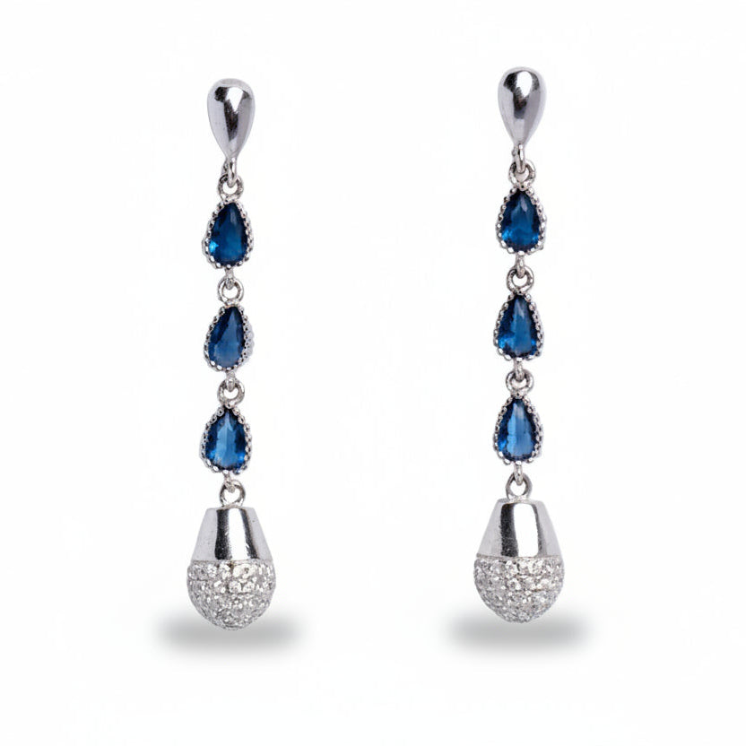 Pair of silver earrings with blue gemstones on a white background