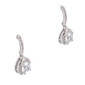 Pair of silver earrings with clear gemstones on a white background