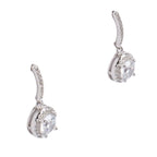 Pair of silver earrings with clear gemstones on a white background