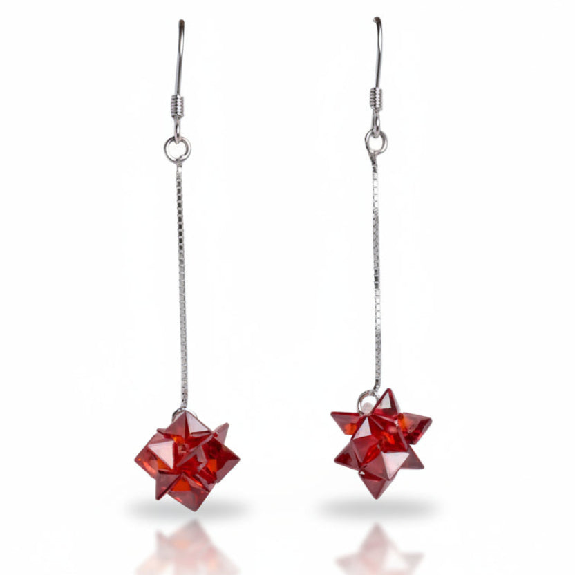Red star-shaped earrings on a white background