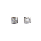 Pair of silver square-cut stud earrings on a light gray background