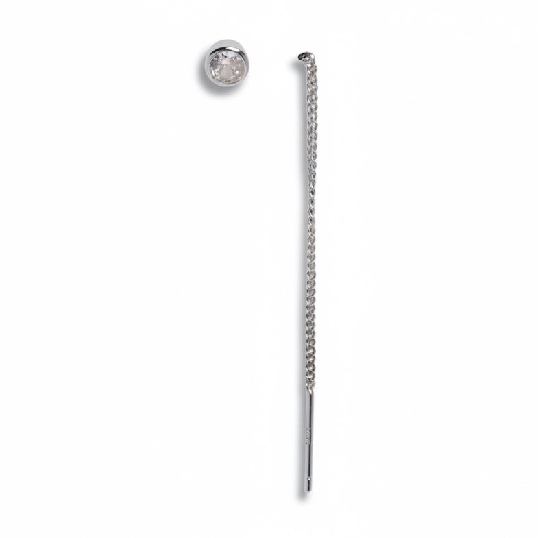 Silver chain earring on a light gray background