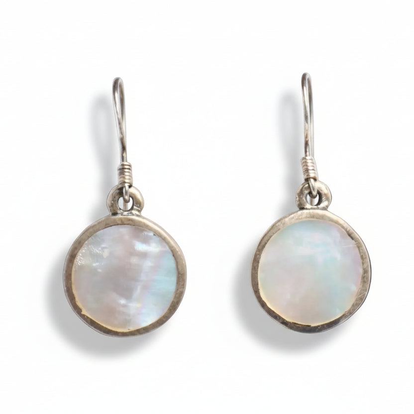 Pair of earrings with round, light-colored gemstones on a white background