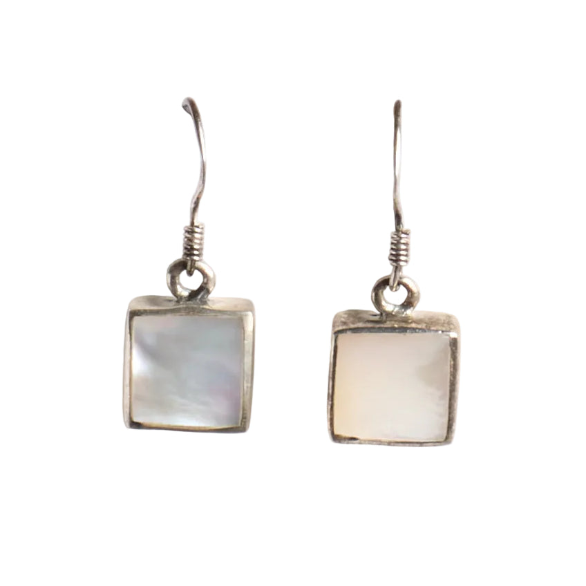 Pair of square-shaped earrings with a white stone on a white background