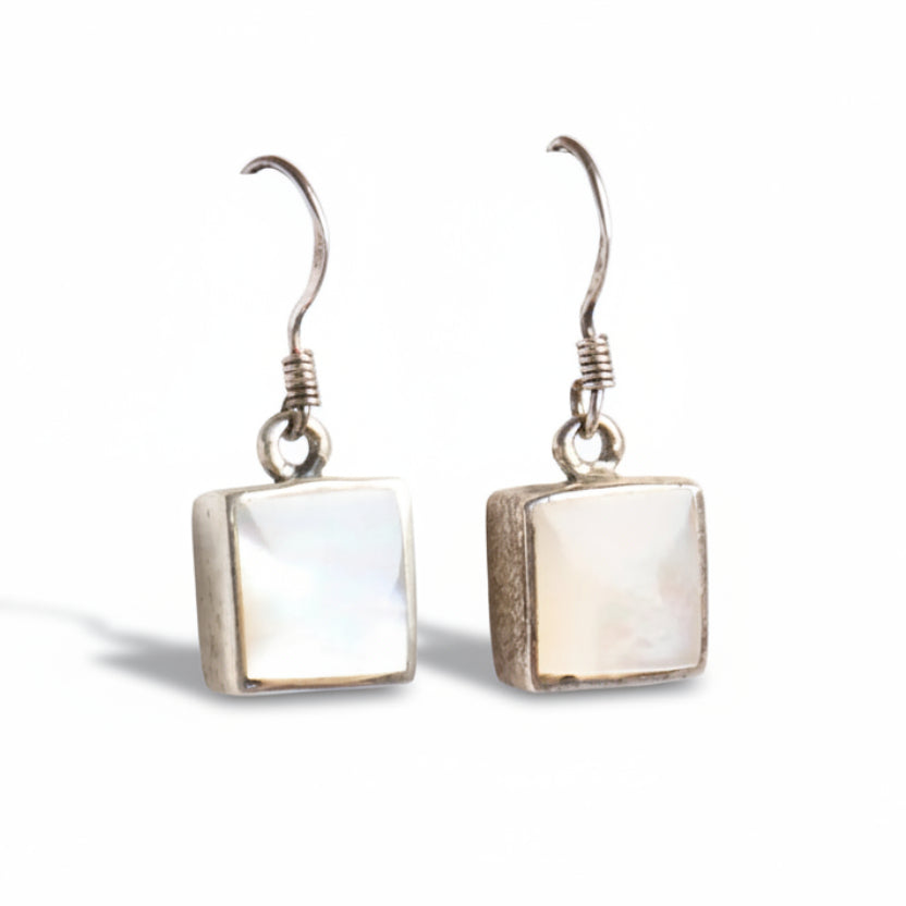 Pair of square mother of pearl earrings on a white background