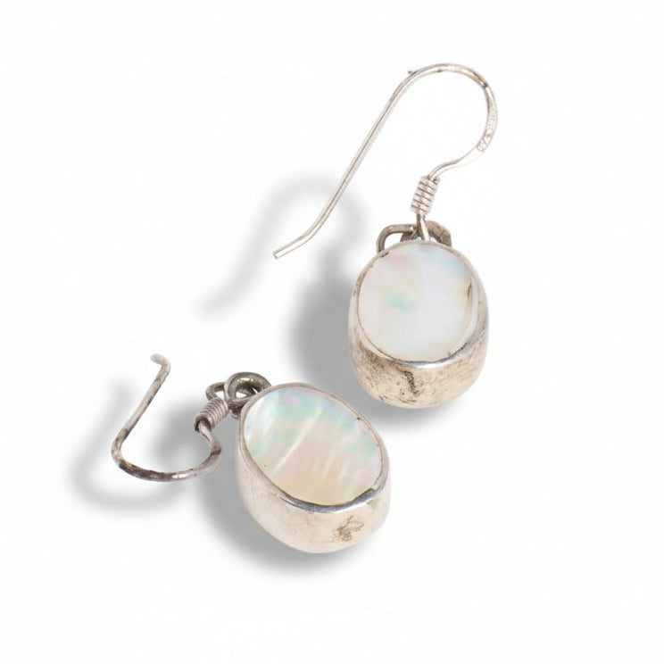 Pair of silver earrings with opal stones on a white background