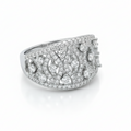 Silver ring with diamond accents on a white background