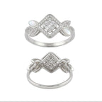 Two silver rings with intricate designs on a white background