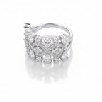 Silver ring with gemstones on a light gray background