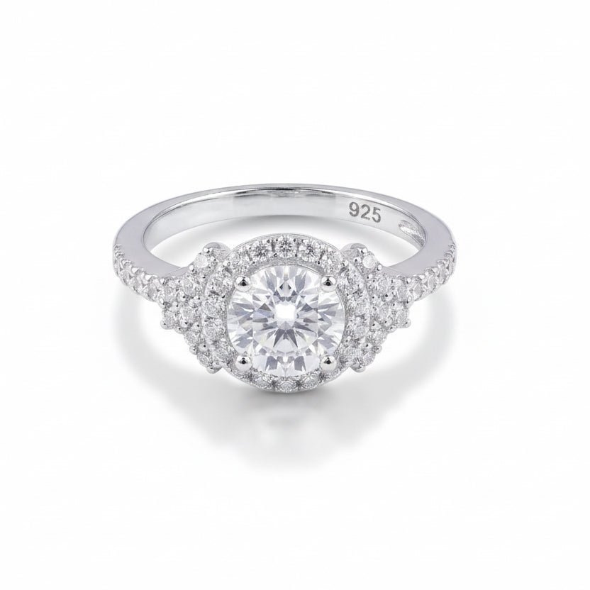 Silver ring with a diamond on a white background