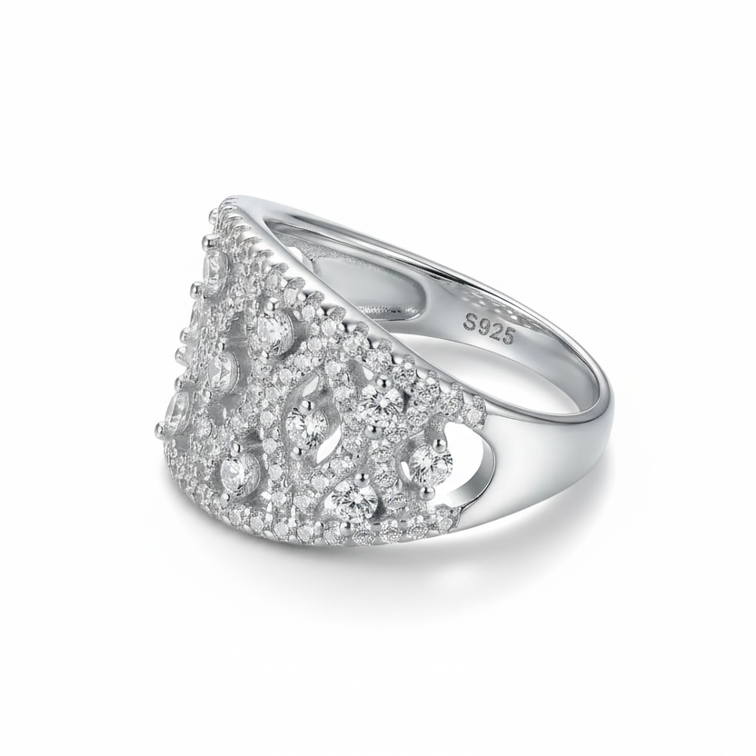 Silver ring with diamond accents on a white background